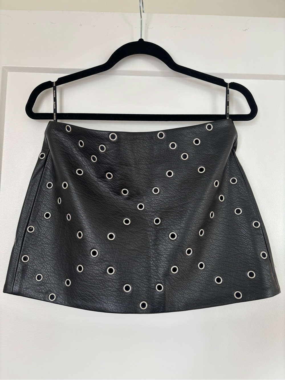 Blank NYC Black Faux Leather Eyelet Mini Skirt